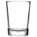 A close up of a Libbey 4 oz. clear glass with a white background.