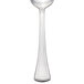 A Walco stainless steel dessert spoon with a long stem and a silver bowl.