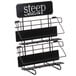 A black metal Steep by Bigelow tea rack with three shelves.