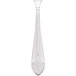 A Walco stainless steel demitasse spoon with a white handle.