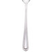 A Walco stainless steel iced tea spoon with a white handle.