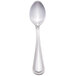 A Walco stainless steel teaspoon with a tall handle.