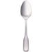 A Walco stainless steel dessert spoon with a silver handle.