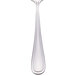 A Walco stainless steel tablespoon with a white handle.