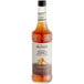A bottle of Monin Zero Calorie Natural Caramel Flavoring Syrup with a white label.