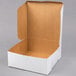 A white box with a brown lid.