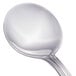 A close-up of a Walco stainless steel bouillon spoon with a silver handle and spoon.
