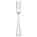 A silver Walco stainless steel dinner fork.