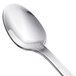 A close-up of a Walco 18/0 stainless steel iced tea spoon with a silver handle.