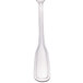 A close-up of a Walco stainless steel serving spoon with a white background.