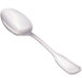 A close-up of a Walco Saville stainless steel serving spoon with a silver handle.