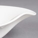 A close up of a Villeroy & Boch white porcelain deep bowl with a curved edge.