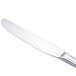 A Walco stainless steel European table knife with a silver handle.
