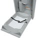 A grey plastic baby changing table with a diaper on it lined with a Lavex Baby Changing Table Liner.