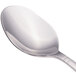 A close-up of a Walco Meteor stainless steel dessert spoon with a silver handle.