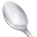 A close-up of a Walco stainless steel teaspoon with a silver handle.