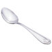 A Walco stainless steel serving spoon with a handle.