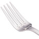 A close-up of a Walco Saville stainless steel salad fork with four prongs.
