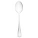 A Walco stainless steel tablespoon with a white handle and silver spoon.