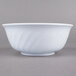 A close up of a white Thunder Group melamine bowl with a wavy design.