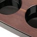 A Libbey Cherry Wood melamine flight paddle with black cups on it.