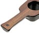A close up of the wooden handle of a Libbey Cherry Wood Melamine Flight Paddle.