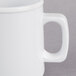 A close up of a white Thunder Group melamine mug with a handle.