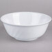 A white Thunder Group Imperial melamine swirl bowl with a white rim on a gray surface.