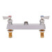 A Fisher brass faucet base with swivel outlets and lever handles on a white background.