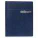 A blue House of Doolittle notebook with a spiral bound cover and white marks on it.