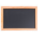 An Aarco oak framed blackboard.