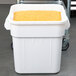 A white square Continental ingredient bin full of yellow grains.