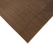 A close-up of a light brown woven vinyl placemat.