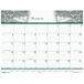 A House of Doolittle desk pad calendar with a white background and nature photo theme featuring trees.