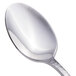 A close-up of a Walco 18/10 stainless steel teaspoon with an ironstone handle.