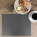 A customizable gray faux leather rectangle placemat with a plate of pastries and a cup of coffee on it.