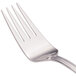 A close-up of a Walco stainless steel cold meat fork with a silver handle.