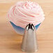 A cupcake with pink frosting piped with an Ateco closed star nozzle.