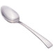 A close-up of a Walco stainless steel demitasse spoon with a silver handle.