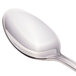 A close-up of a Walco stainless steel iced tea spoon with a silver handle.
