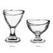 Two Acopa clear glass dessert dishes with different shapes and sizes.