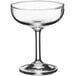 An Acopa clear glass coupe with a stem.