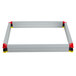 A metal rectangular mousse frame with red, yellow, and black corners.