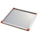 A Matfer Bourgeat square metal mousse frame with red corners.