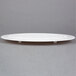 A white Wilton cake separator plate with a smooth edge.
