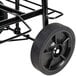 A black Sterno insulated food carrier travel cart with wheels.