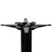 A black metal Lancaster Table & Seating end column table base with four metal parts.