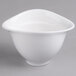 A white porcelain bowl with a curved edge and cover.