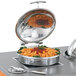 A Vollrath stainless steel chafer with pasta and sauce in a porcelain food pan.