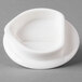 The lid for a Villeroy & Boch white porcelain teapot on a gray surface.